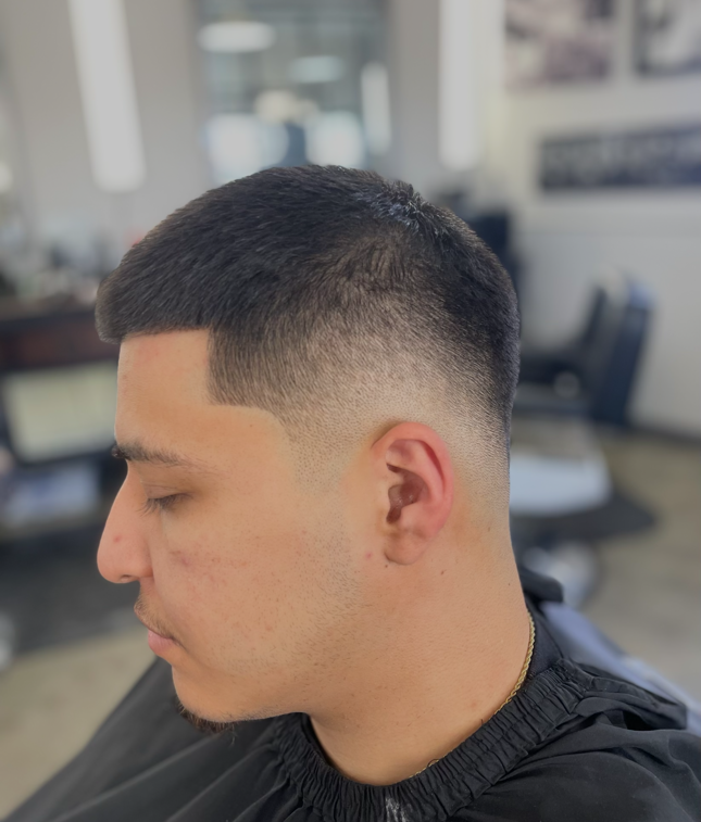 Short crop haircut with a smooth fade by Daniel